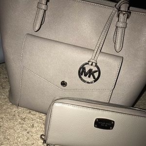 grey MK purse with the matching wallet